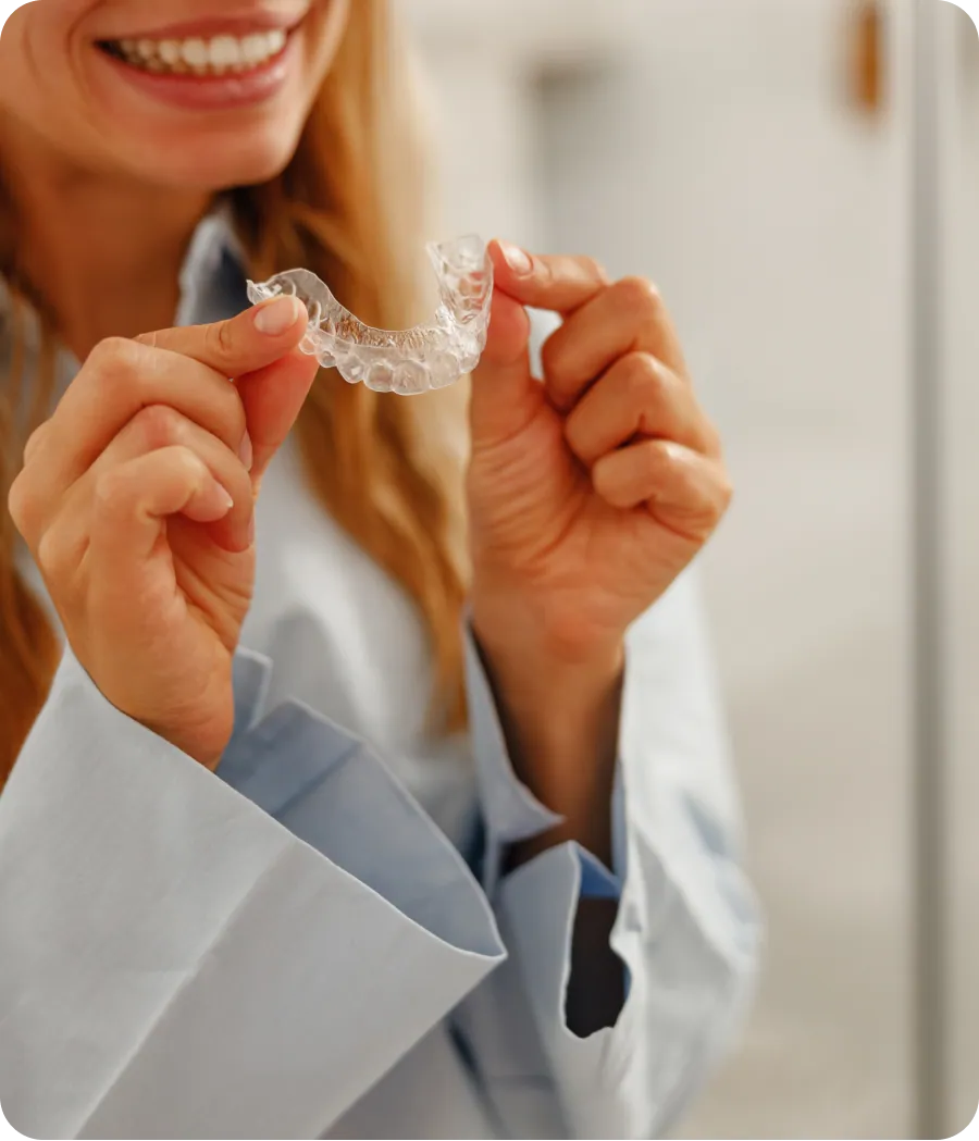 Patient fitting an Invisalign aligner