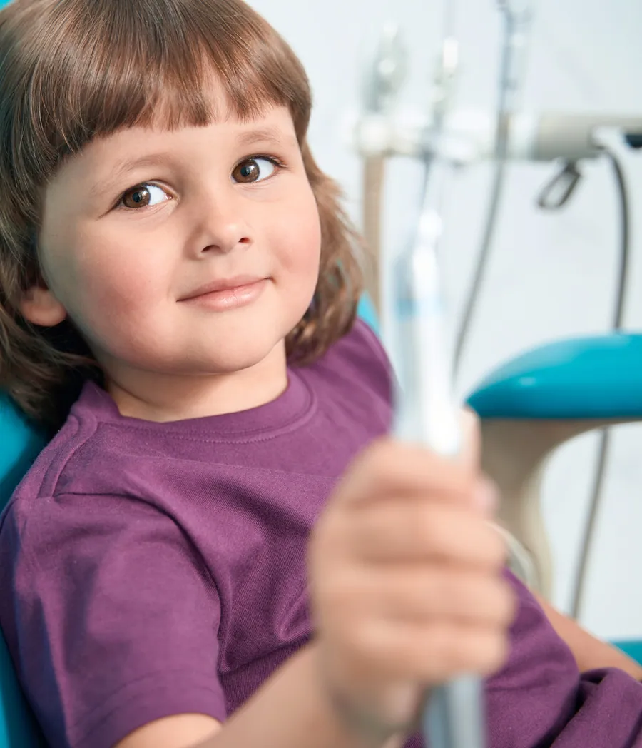 Fluoride varnish being applied to a child's teeth