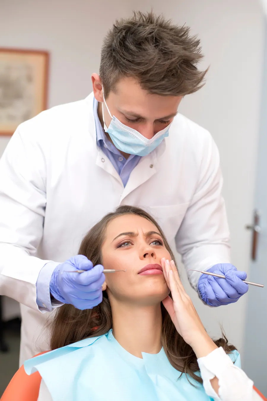 Dentist assessing an urgent dental problem